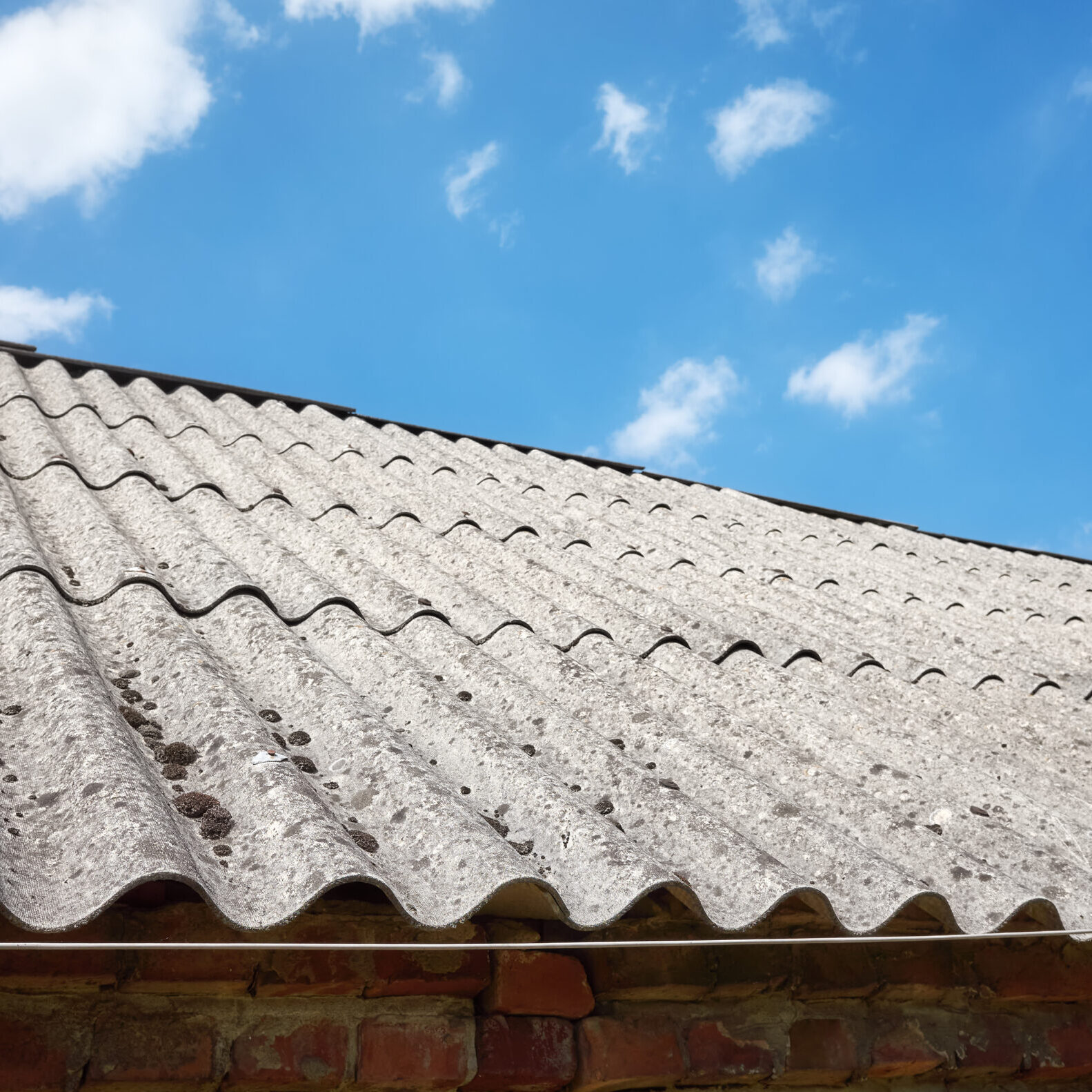 Picture of a roof made of carcinogenic asbestos tiles, selective focus.